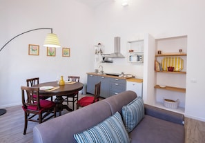 Apartment | Living area | 24-inch flat-screen TV with digital channels - Mamo Florence - Borgo Santa Croce Apartment (Florence)