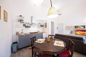 Apartment | Living area | 24-inch flat-screen TV with digital channels - Mamo Florence - Borgo Santa Croce Apartment (Florence)