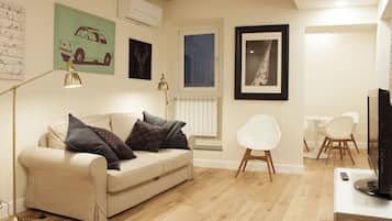 Apartment | Living area | 24-inch flat-screen TV with digital channels