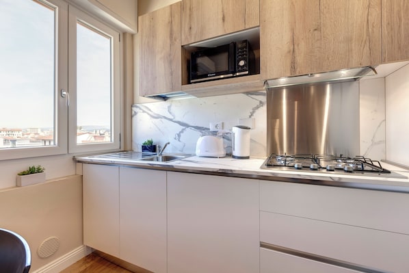 Apartment | Private kitchenette | Full-size fridge, microwave, stovetop, dishwasher