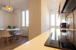 Apartment | Private kitchenette | Full-sized fridge, microwave, oven, stovetop - Mamo Florence - Mosse Leopolda Apartment (Florence)