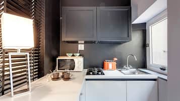 Apartment | Private kitchenette | Full-sized fridge, microwave, stovetop, toaster