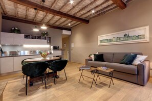 Apartment | Living area | 24-inch flat-screen TV with digital channels - Mamo Florence - Santa Croce Loft Apartment (Florence)