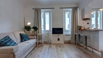 Apartment | Living area | 24-inch flat-screen TV with digital channels