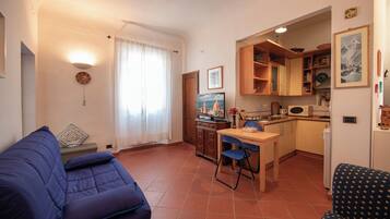 Apartment | Living area | 24-inch flat-screen TV with digital channels