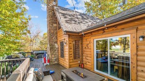 A log cabin with a deck, outdoor seating, and a fire pit. - Luxury Cabin Vibes • Walk to Thunder Ridge (Ridgedale)