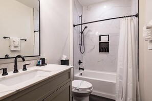 Shower, hair dryer, towels - Historic + Modern Downtown Hotel (New Orleans)