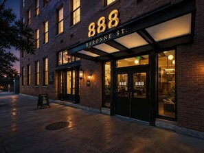 A building with the number 888 on the facade, indicating a hotel or similar establishment.