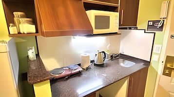 Fridge, microwave, cookware/dishes/utensils