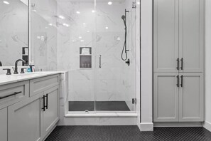 Shower, hair dryer, towels, shampoo