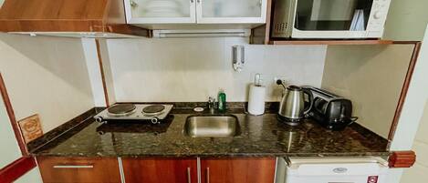 Fridge, microwave, cookware/dishes/utensils