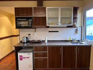 Fridge, microwave, cookware/dishes/utensils