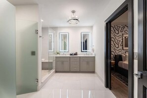 Shower, hair dryer, towels, shampoo