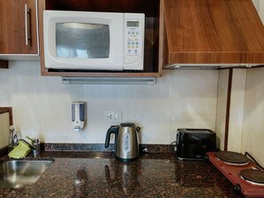 Fridge, microwave, cookware/dishes/utensils