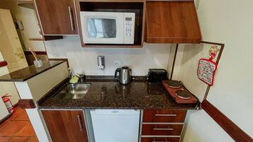 Fridge, microwave, cookware/dishes/utensils