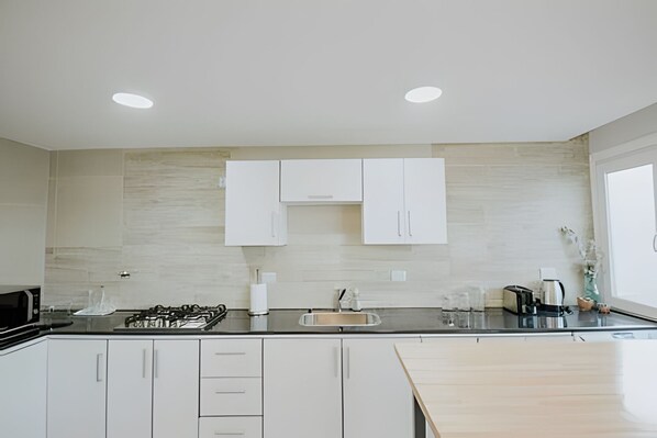 Fridge, microwave, cookware/dishes/utensils