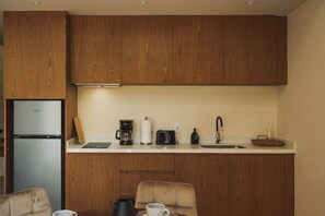 Fridge, microwave, stovetop, coffee/tea maker