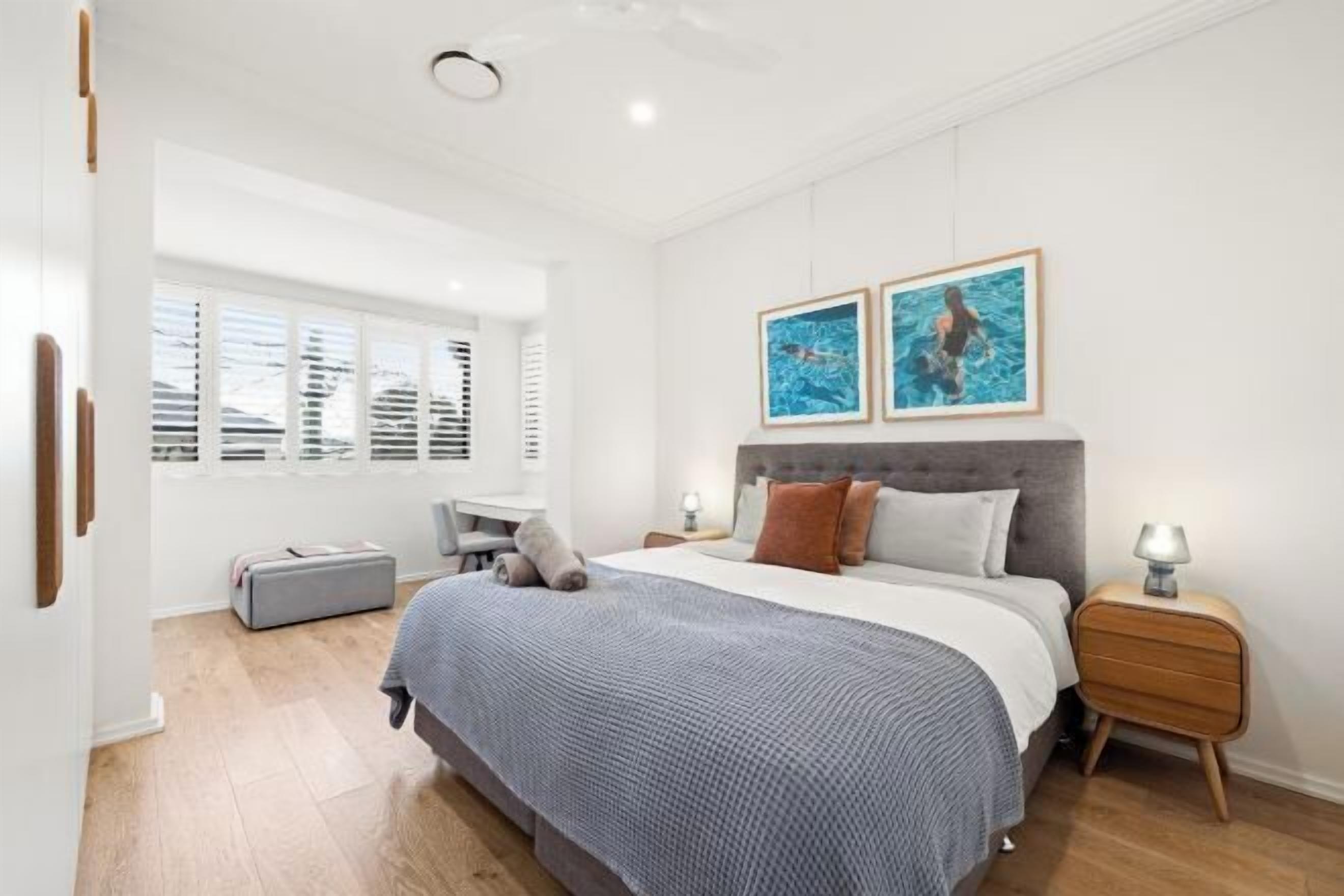 Desk, laptop workspace, blackout drapes, iron/ironing board