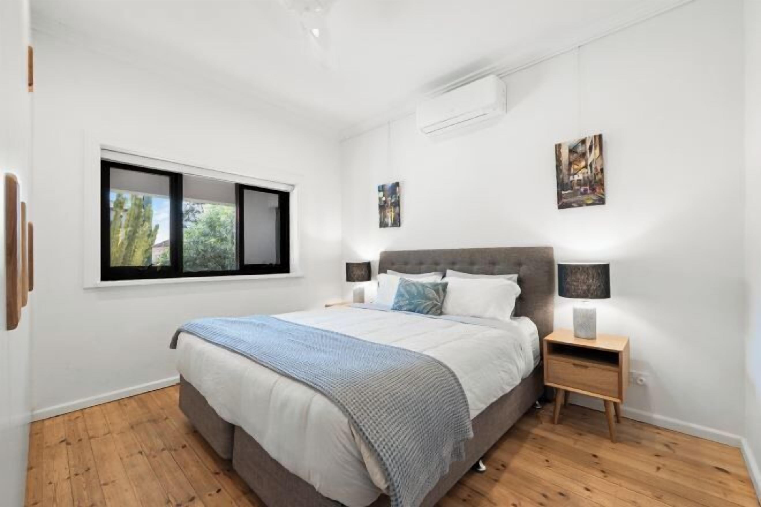 Desk, laptop workspace, blackout drapes, iron/ironing board