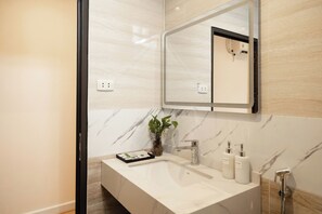 Suite, Balcony, City View | Bathroom | Shower, slippers, soap, shampoo