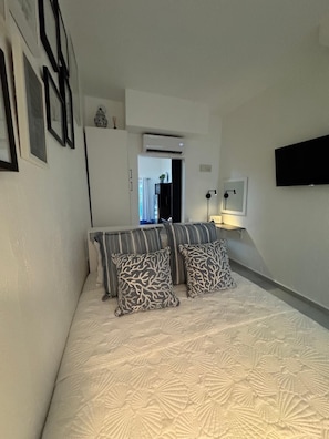 1 bedroom, desk, iron/ironing board, travel crib
