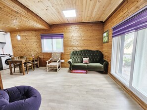 Duplex | Living area | 32-inch flat-screen TV with cable channels