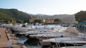 A marina with boats docked, a waterfront view, and buildings in the background. - Holiday Home 'Villabergerie En Pierre Du Pays' with Private Pool, Wi-Fi and Air Conditioning (Barbaggio)