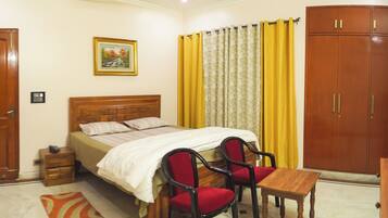 Premium Single Room, Smoking, Private Bathroom | Desk, laptop workspace, blackout drapes, iron/ironing board