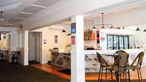 A bar area with seating, a counter, and various amenities. - Grafton Hotel (Grafton)