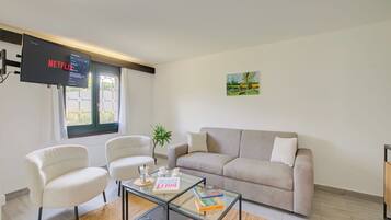 Standard Apartment, 1 Bedroom (Casa Al Cervo) | Living area | 21-inch Smart TV with digital channels