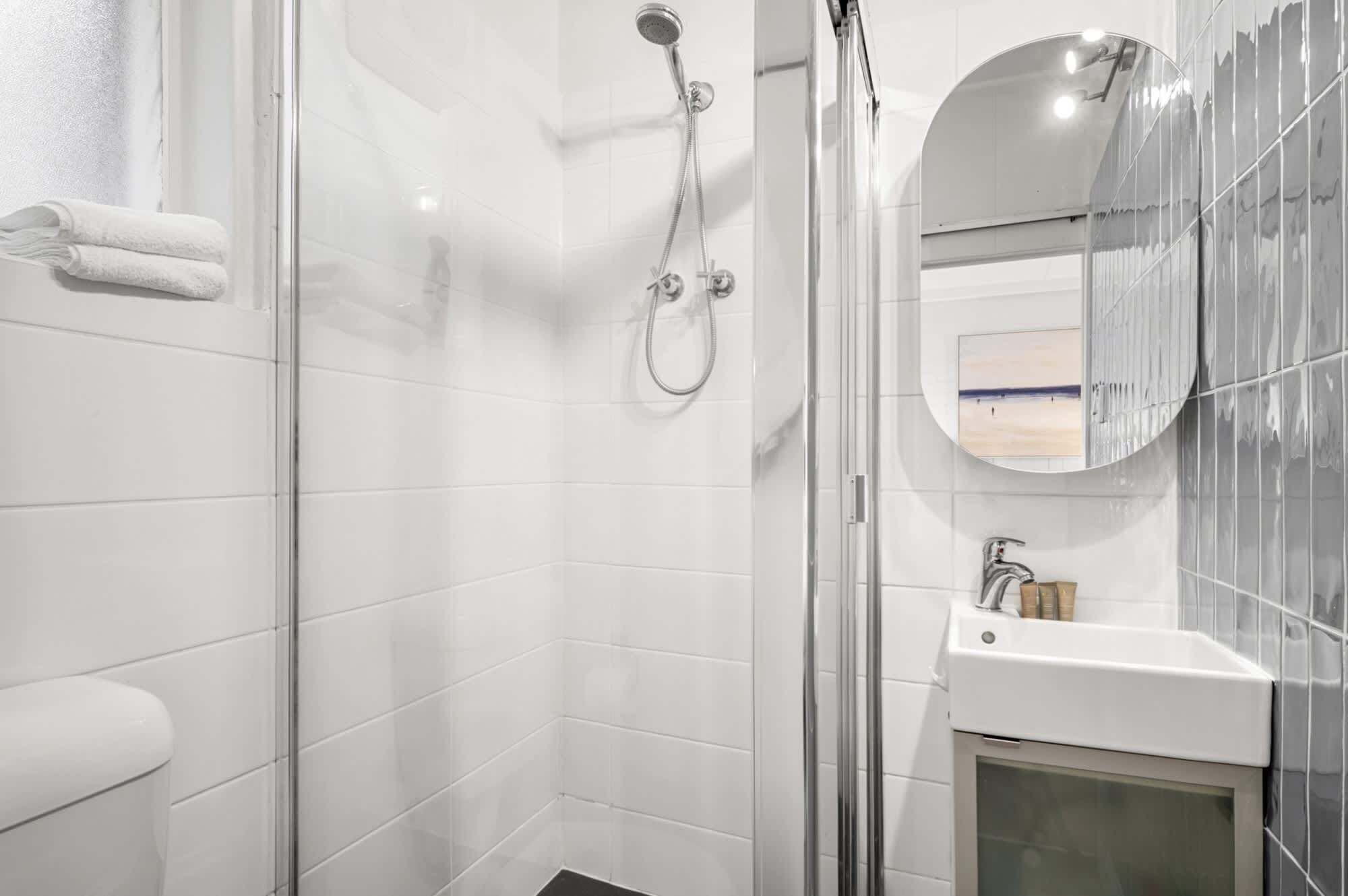 Shower, hair dryer, towels, shampoo
