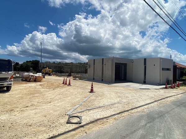 A construction site with a building under construction, surrounded by construction materials and equipment. - Miyako Beach Resort (Miyakojima)