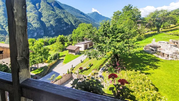 A scenic view of a mountainous area with a pathway leading through lush greenery and a small building. - Stunning private villa with WIFI, private pool, TV, patio, pets allowed and panoramic view (Tione Di Trento)