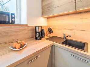 Microwave, oven, dishwasher, dining tables