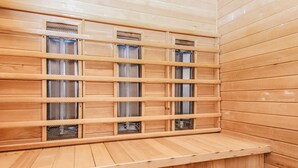 A sauna with wooden walls and benches. - 4 Star Holiday Home in Ulfborg (Ulfborg)