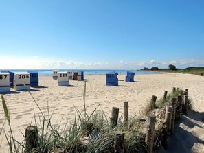 Enjoy a designated beach area with reserved seating for a relaxing day by the ocean.