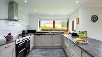 Microwave, oven, dishwasher, dining tables