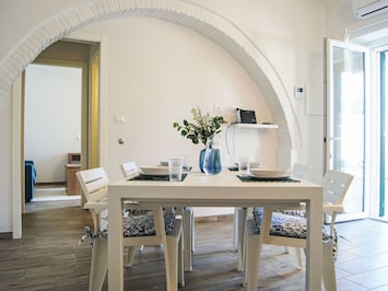 Sky, Property, Furniture, Table, Azure, Chair, Building, Window, Shade, Architecture