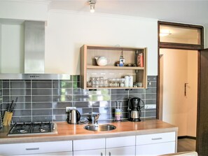 Microwave, dishwasher, dining tables