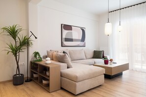 Luxury Apartment, 3 Bedrooms, Kitchen, City View | Living room | 120-inch TV with cable channels