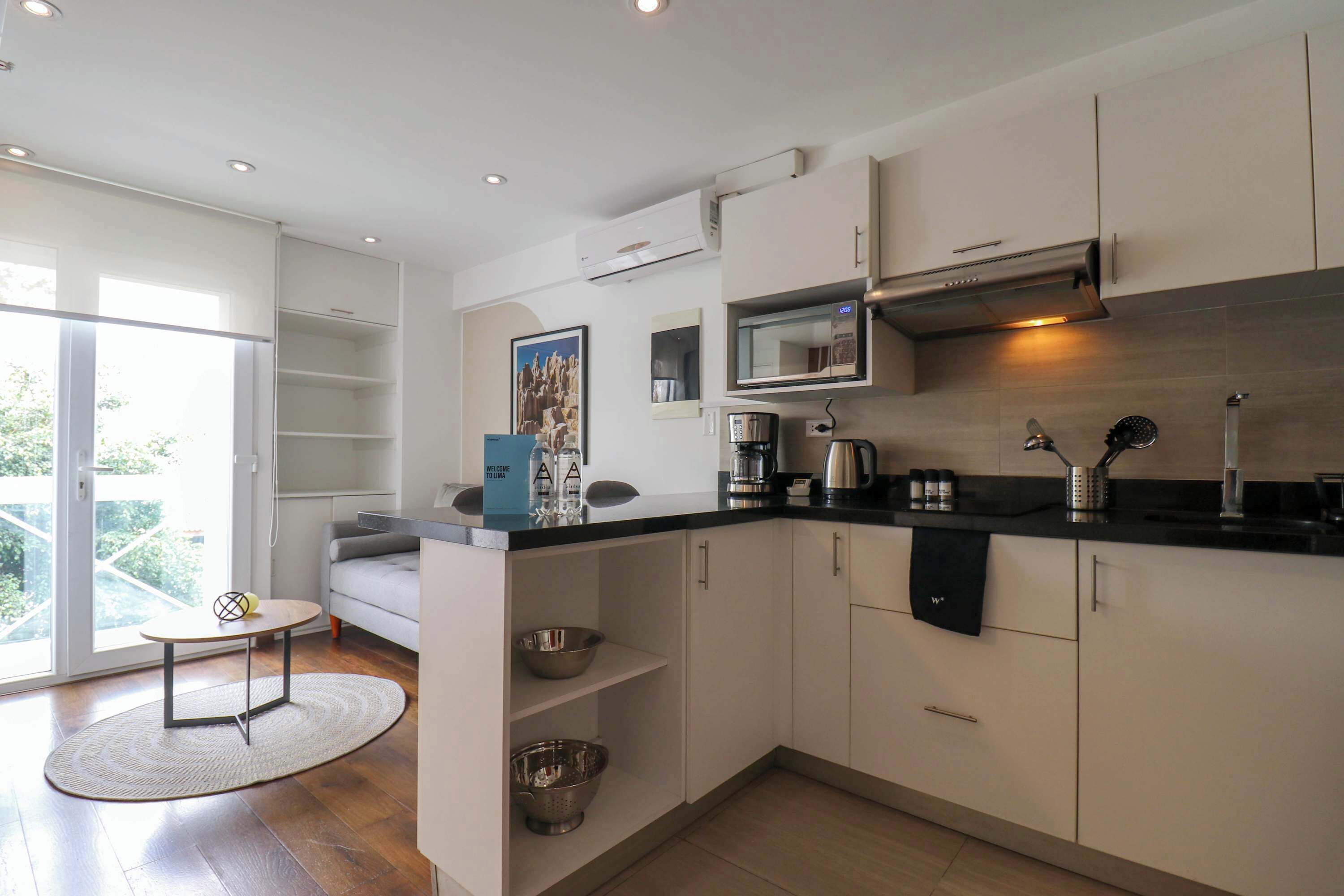 Fridge, microwave, stovetop, coffee/tea maker