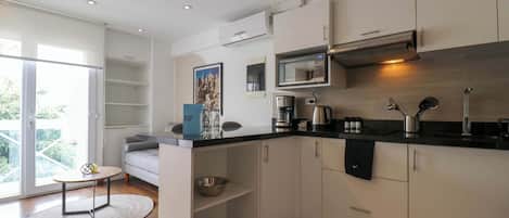 Fridge, microwave, stovetop, coffee/tea maker