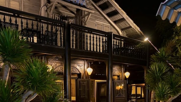 A building with a pool, a sign reading "SABINA", and a balcony with railings. - Sabina Boutique Hotel & Villa Mui Ne (Mui Ne)