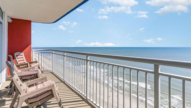 A balcony with a view of the ocean, a railing, and several lounge chairs. - Oceanfront 3bed 3bath condo! 19th floor. Amazing views indoor & outdoor pools (Myrtle Beach)
