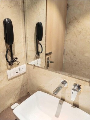 Separate bathtub and shower, towels, soap, shampoo