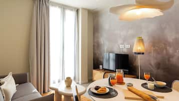 Apartment, 1 Bedroom | Living area | 24-inch Smart TV with digital channels