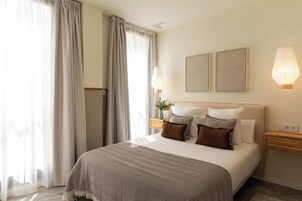 Appartement, 1 chambre | Coffres-forts dans les chambres, fer et planche à repasser