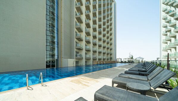 Outdoor pool - Viridis Living Chic and Spacious 1BR (Dubai)