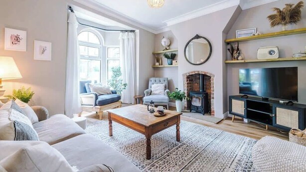A living room with a fireplace, television, and comfortable seating. - Rufloreo Dale (Derbyshire)