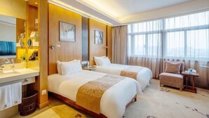 A hotel room with two beds, a bathroom with a sink and mirror, and a large window with curtains. - Meiyuan Hotel (Jiashan)